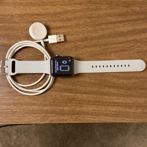 Apple Smartwatch Series 3 GPS + Cellular with Gray Band 38mm face.